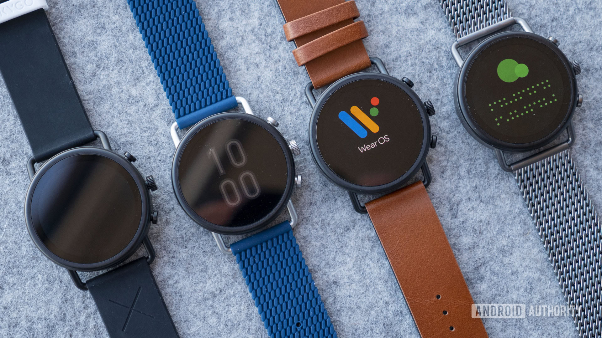 A family of SKAGEN Falster 3 watches rest on a grey wool surface.