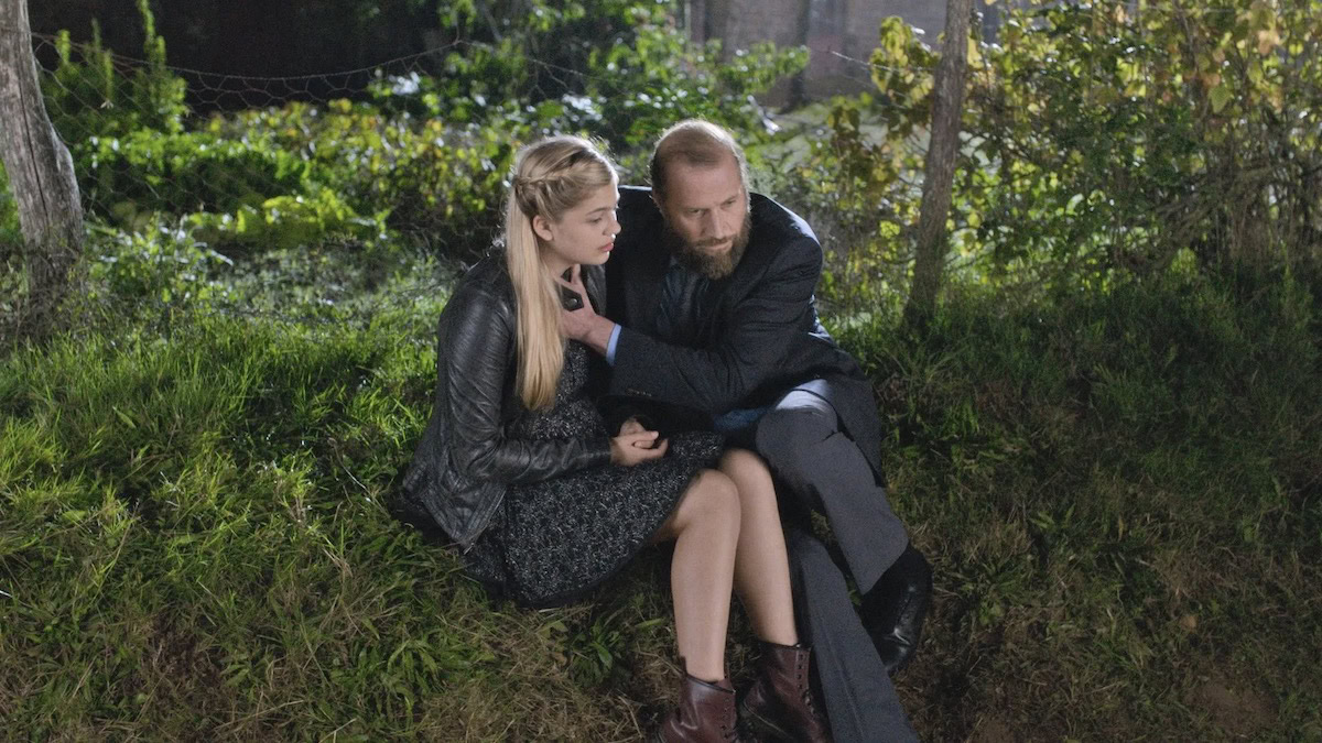 A Deaf father holds his daughter as she sings for him in La Famille Bélier - best movies like CODA