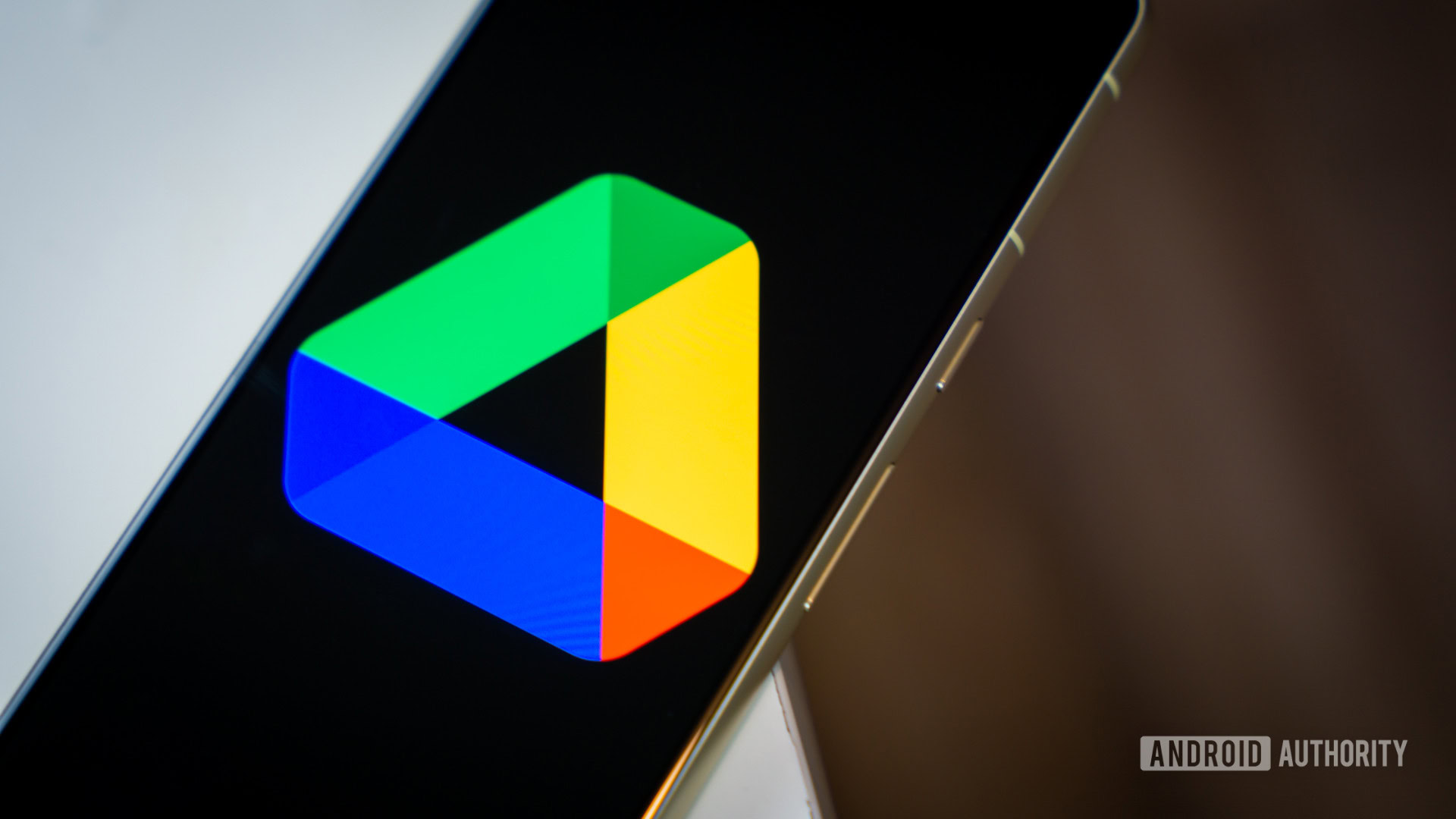 Google Drive logo on smartphone laying on desk Stock photo 2