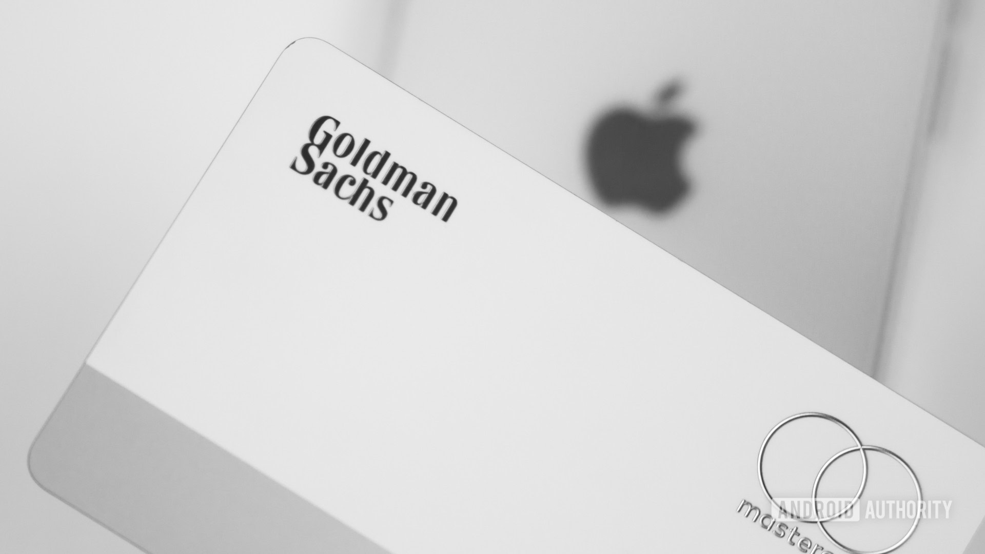 https://www.androidauthority.com/wp-content/uploads/2023/04/Golfman-Sachs-next-to-Apple-smartphone-showing-logo-Stock-Photo.jpg