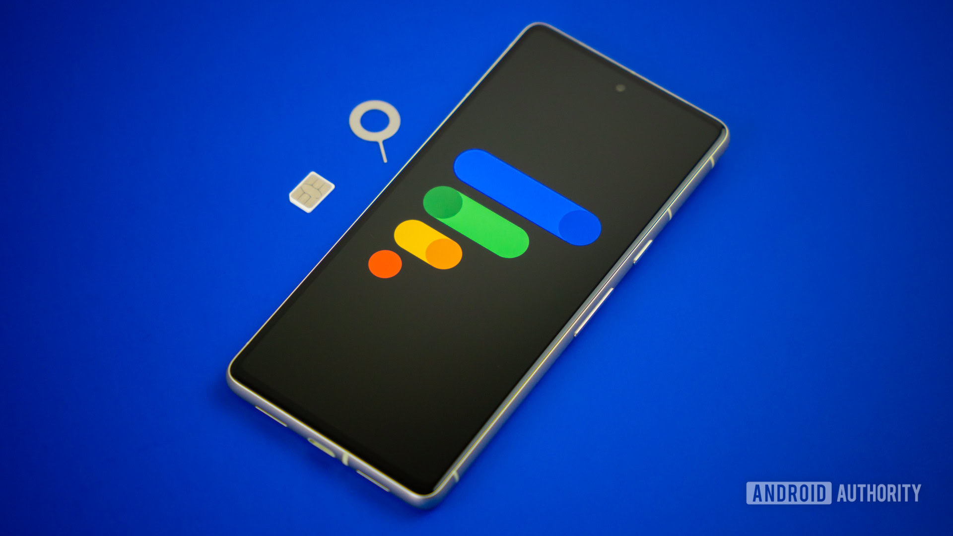 Google Fi Wireless logo on smartphone with SIM card and SIM ejector next to it Stock photo 5