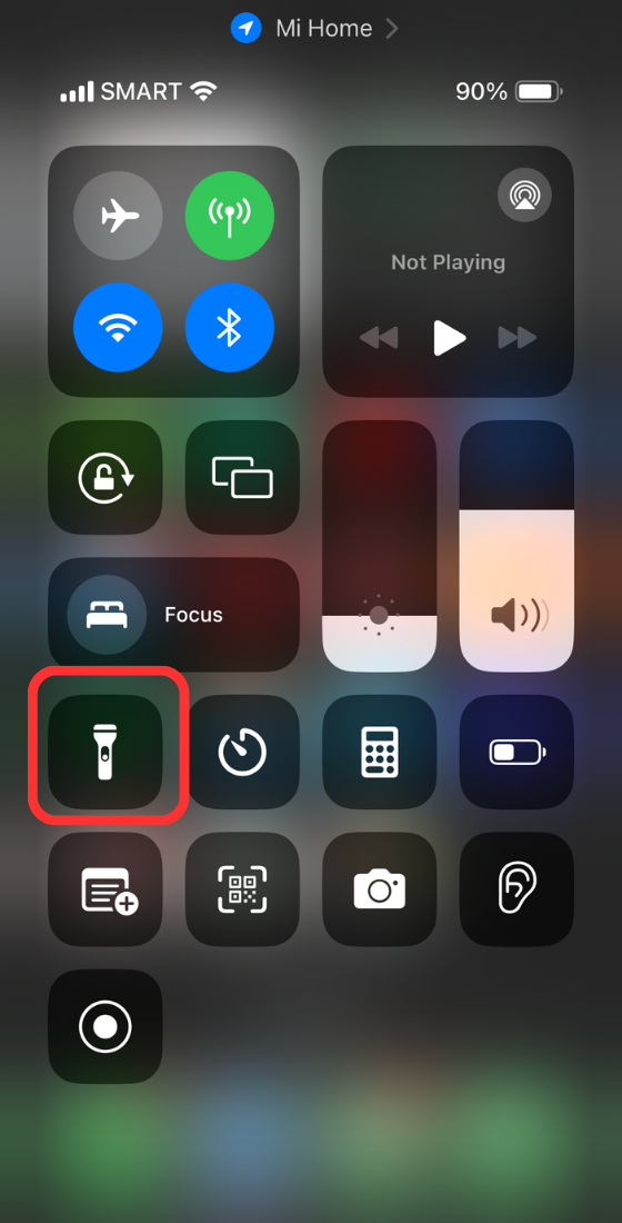 Tap on the flashlight icon