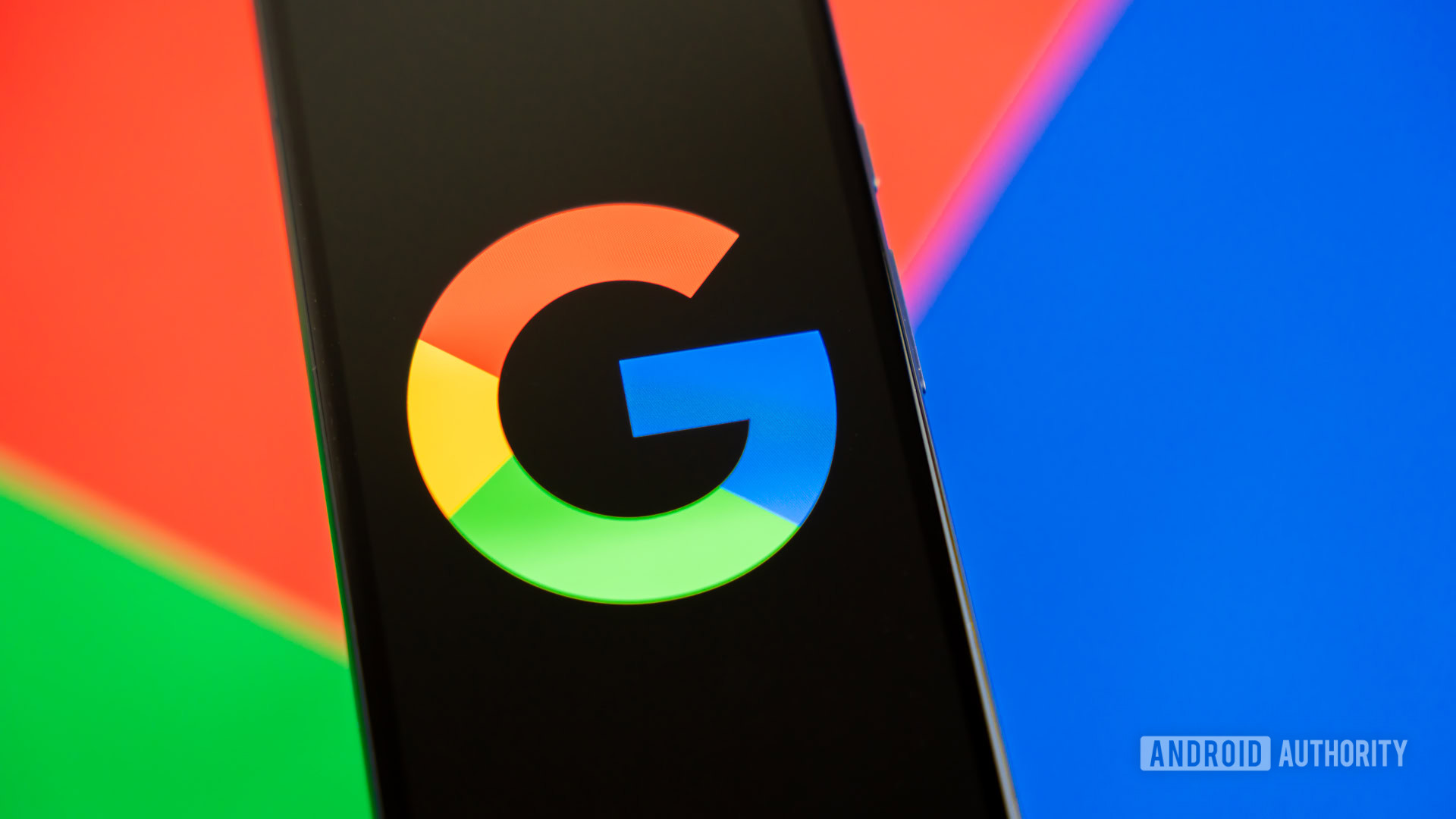 Google or Google Search logo on smartphone, with colorful background stock photo (3)