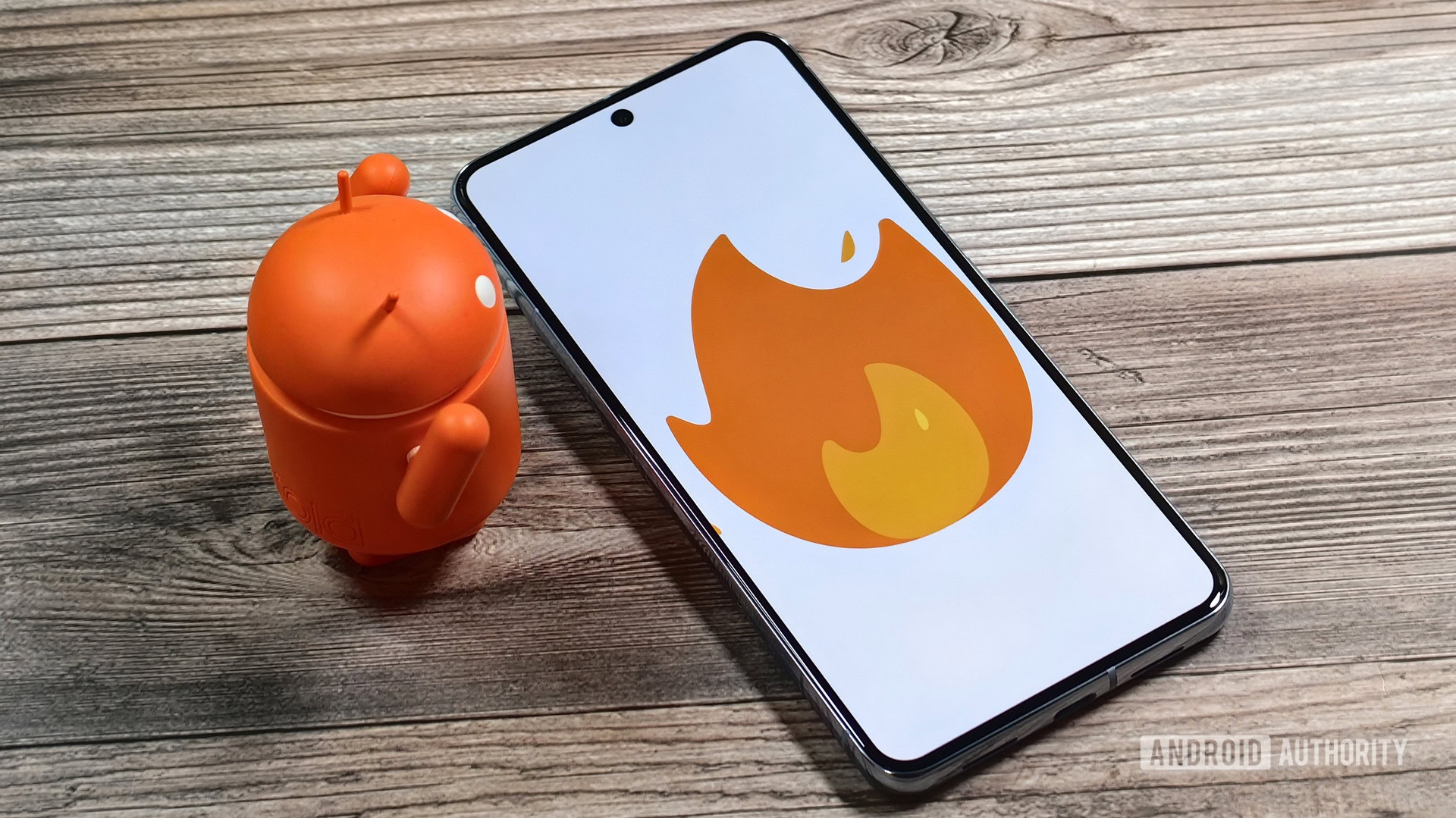 Pixel 8 Pro with fire emoji on display