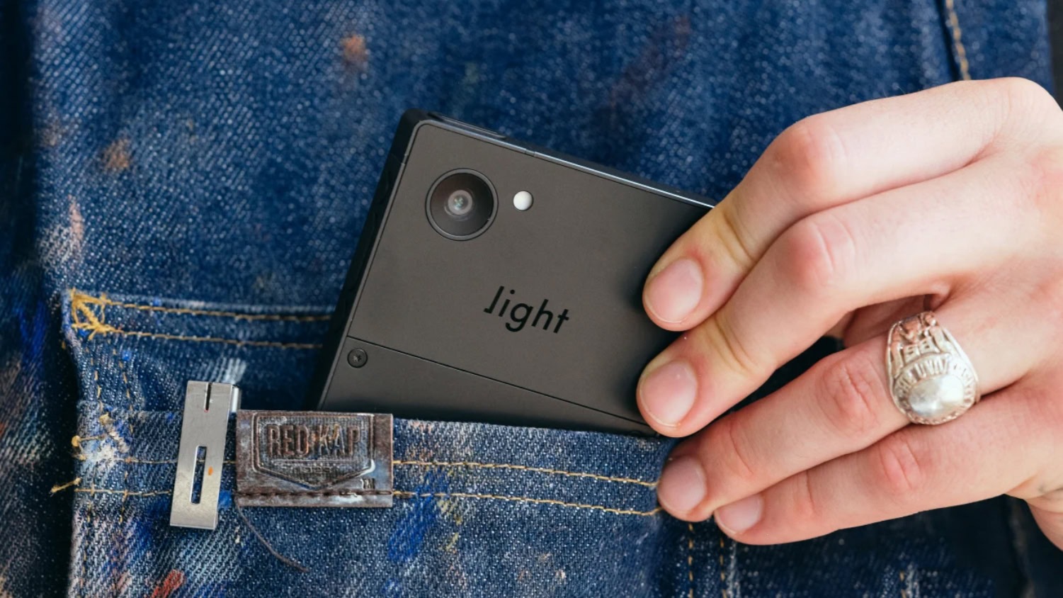 The Light Phone III in shirt pocket
