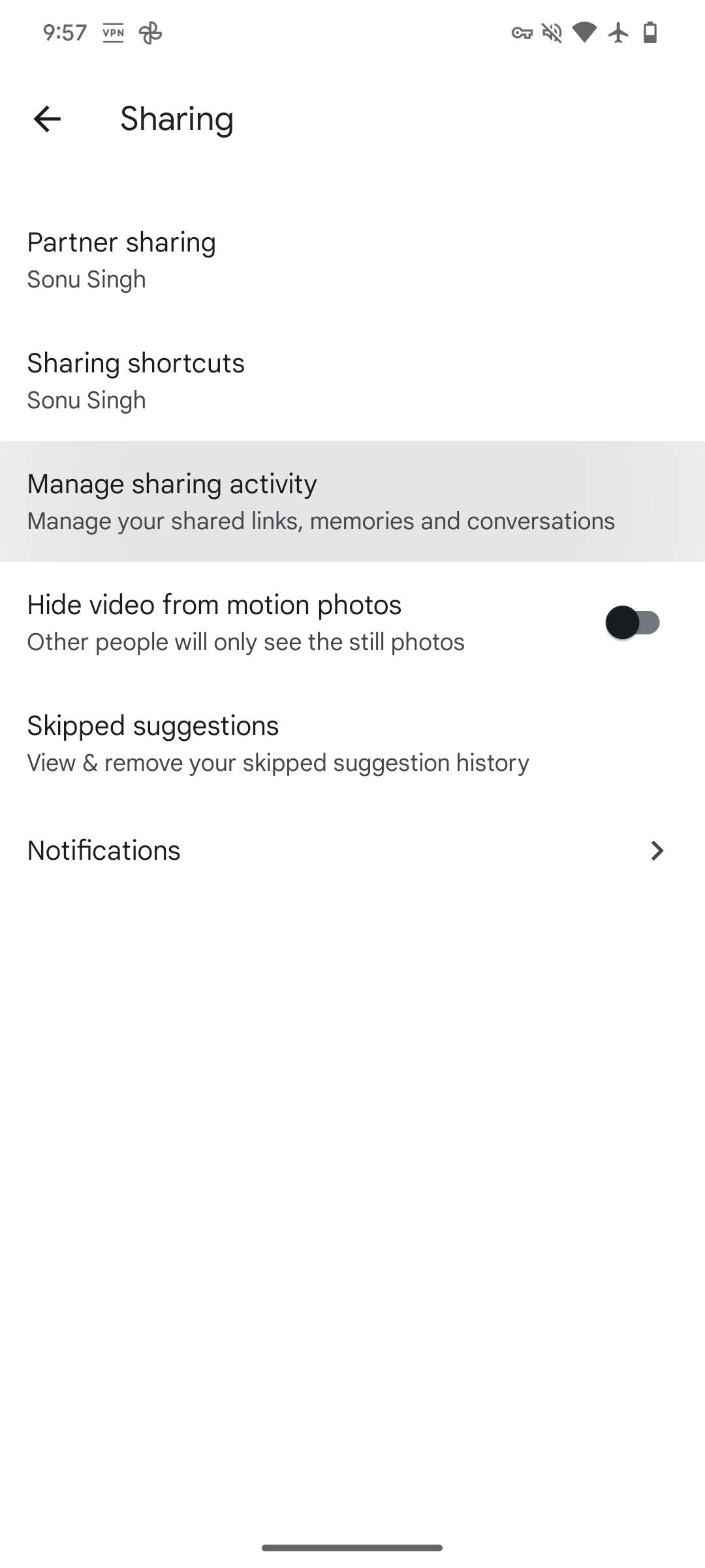 Google Photos screenshot showing Manage Sharing activity option in Sharing settings.