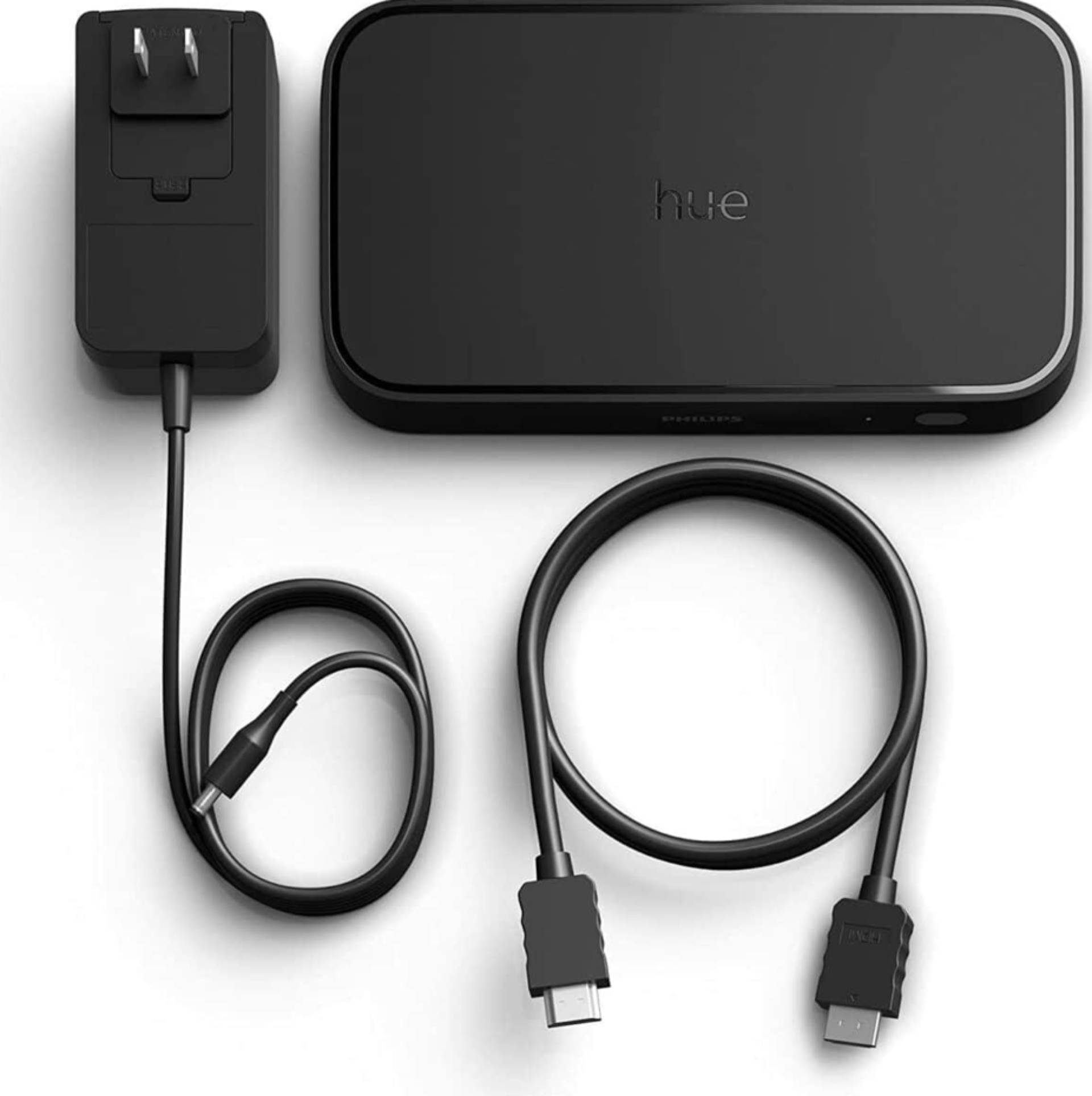 Leaked image of the Philips Hue Play HDMI Sync Box 8K with power brick and HDMI cable.