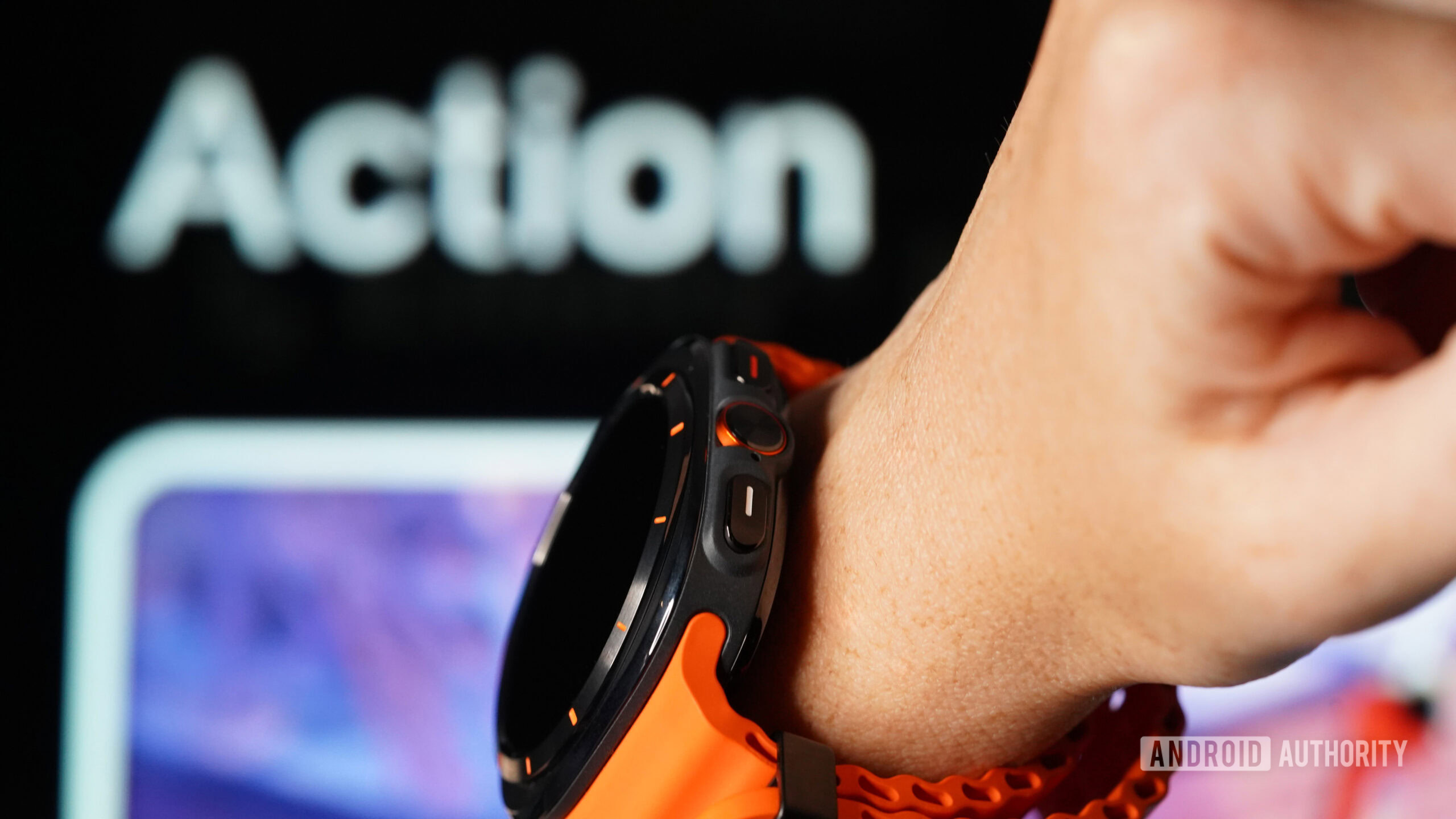 A Samsung Galaxy Watch Ultra user models the device's Action button.