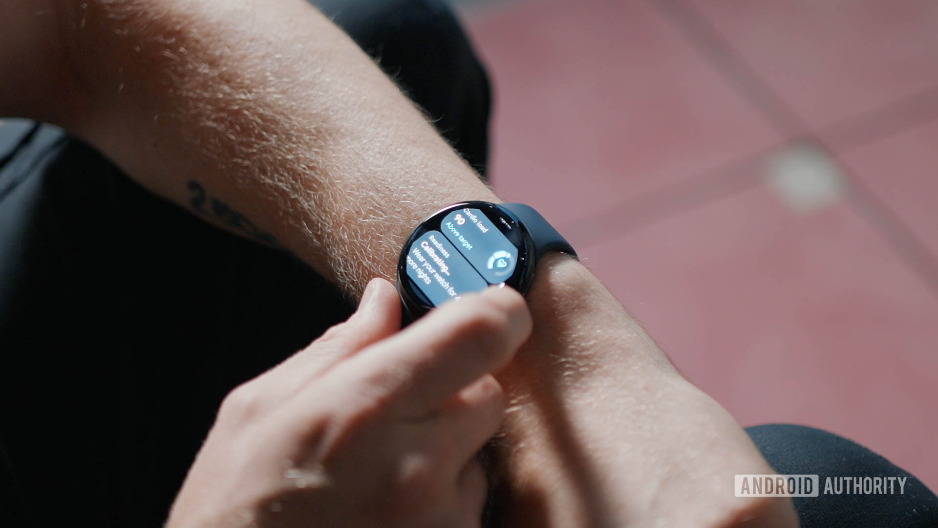 A man swipes through the Google Pixel Watch 3 on his left wrist.