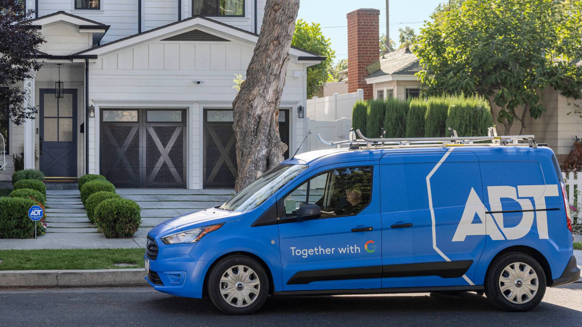 ADT van outside a house