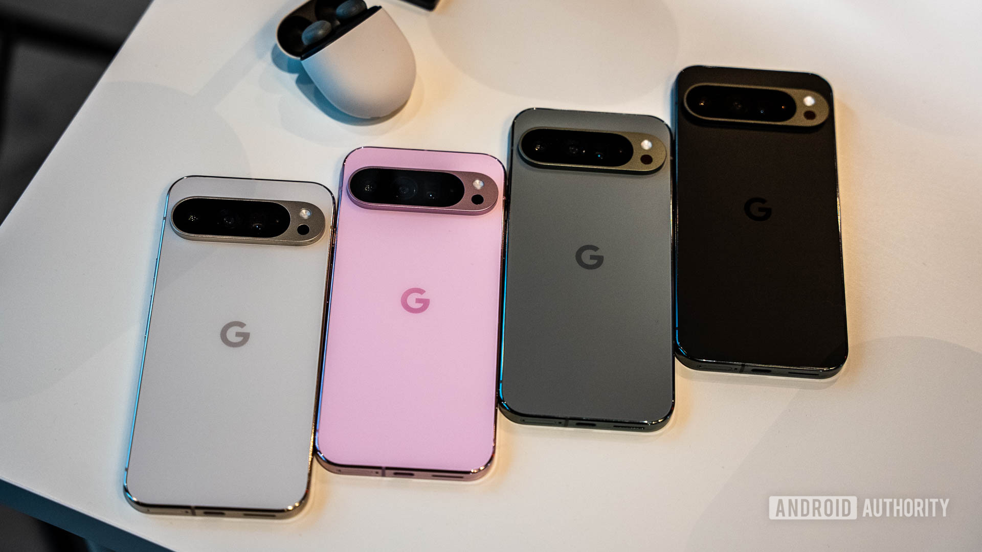 Google Pixel 9 Pro in four colors lined up face down on a table