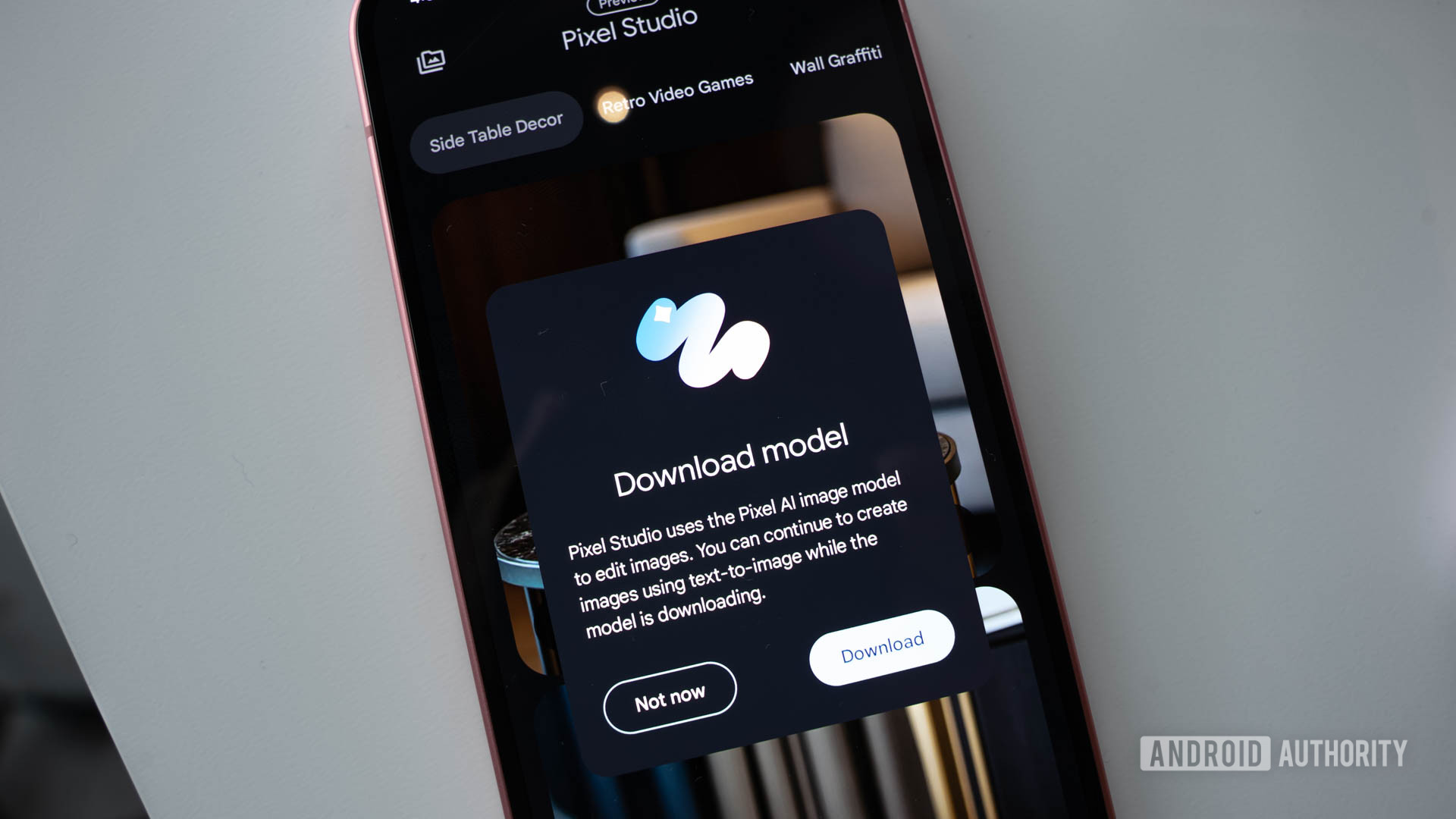 Google Pixel 9 opening the Pixel Studio app showing a prompt to download a new AI image model