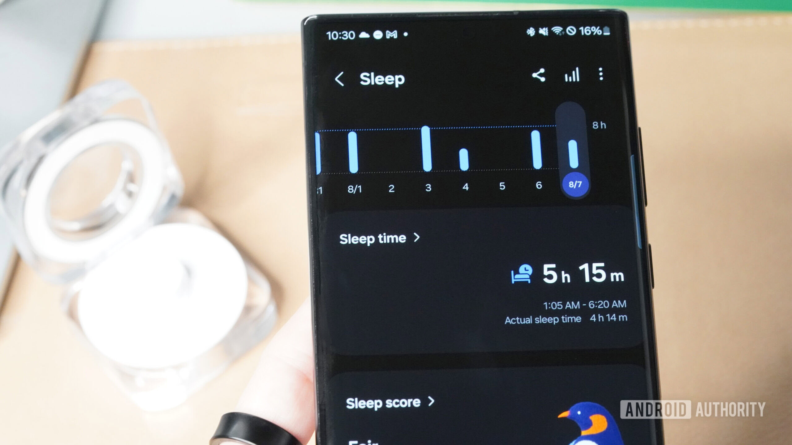 A Samsung Galaxy Ring reviews their sleep data in the companion app.