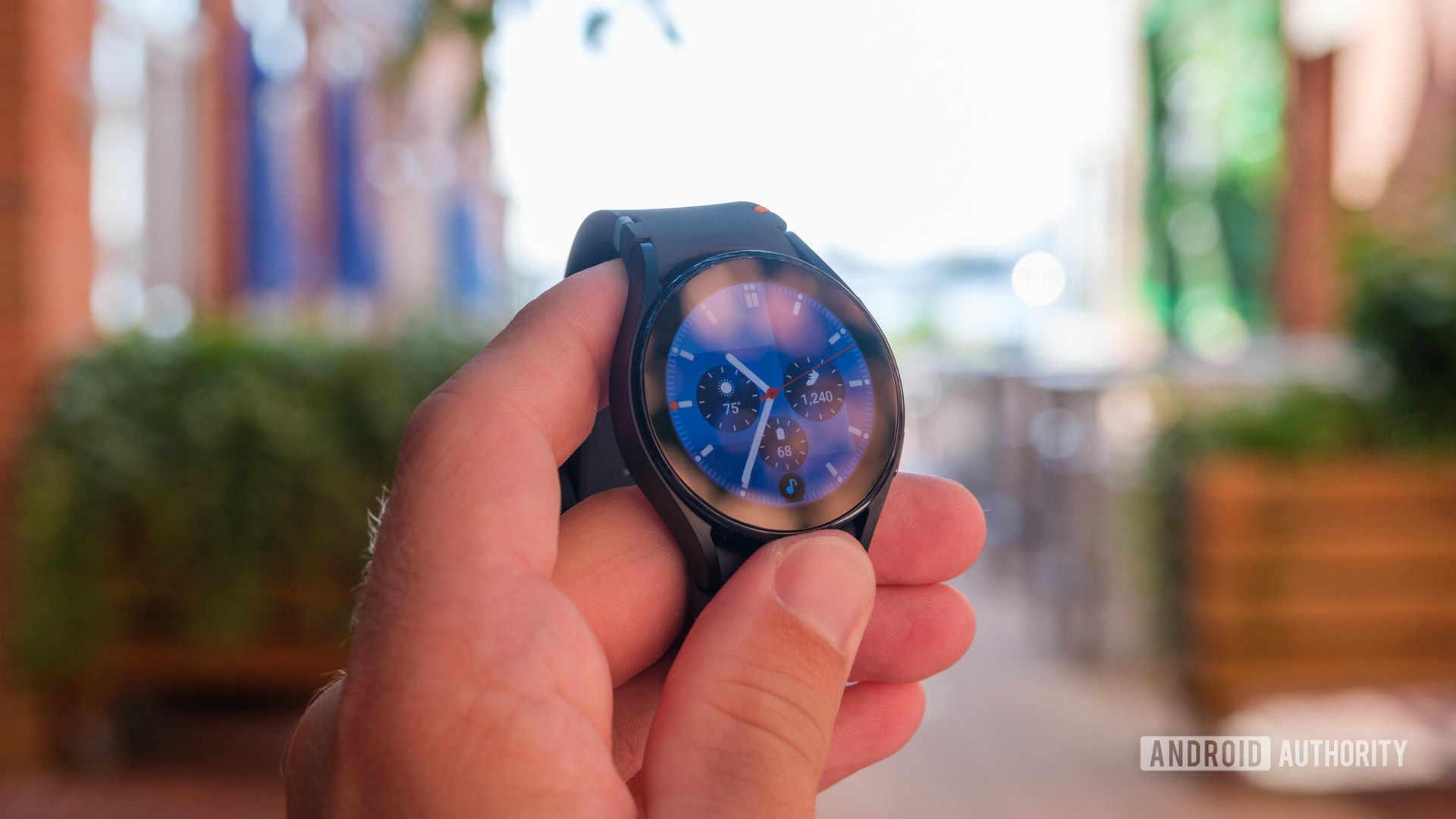 Samsung Galaxy Watch FE face in hand