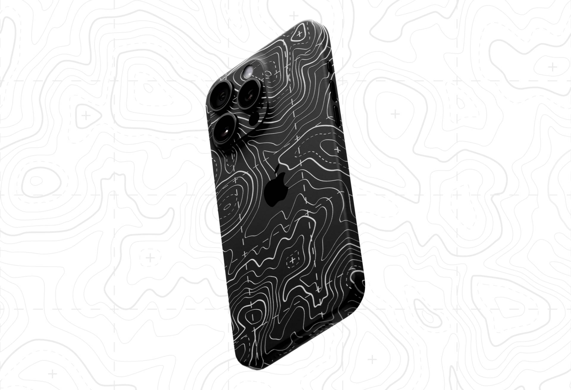 Black Dbrand Area 51 skin on iPhone 16 Pro.