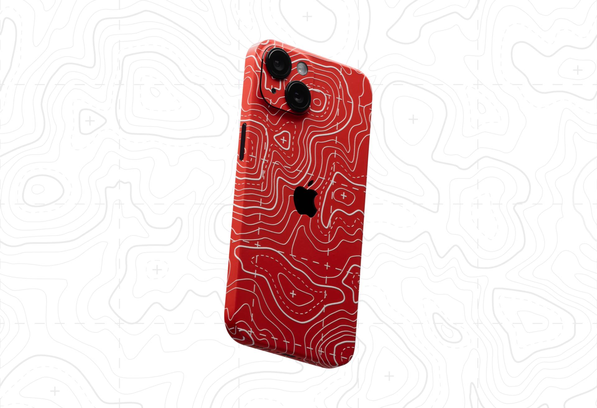 Red Dbrand Area 51 skin on iPhone 16.