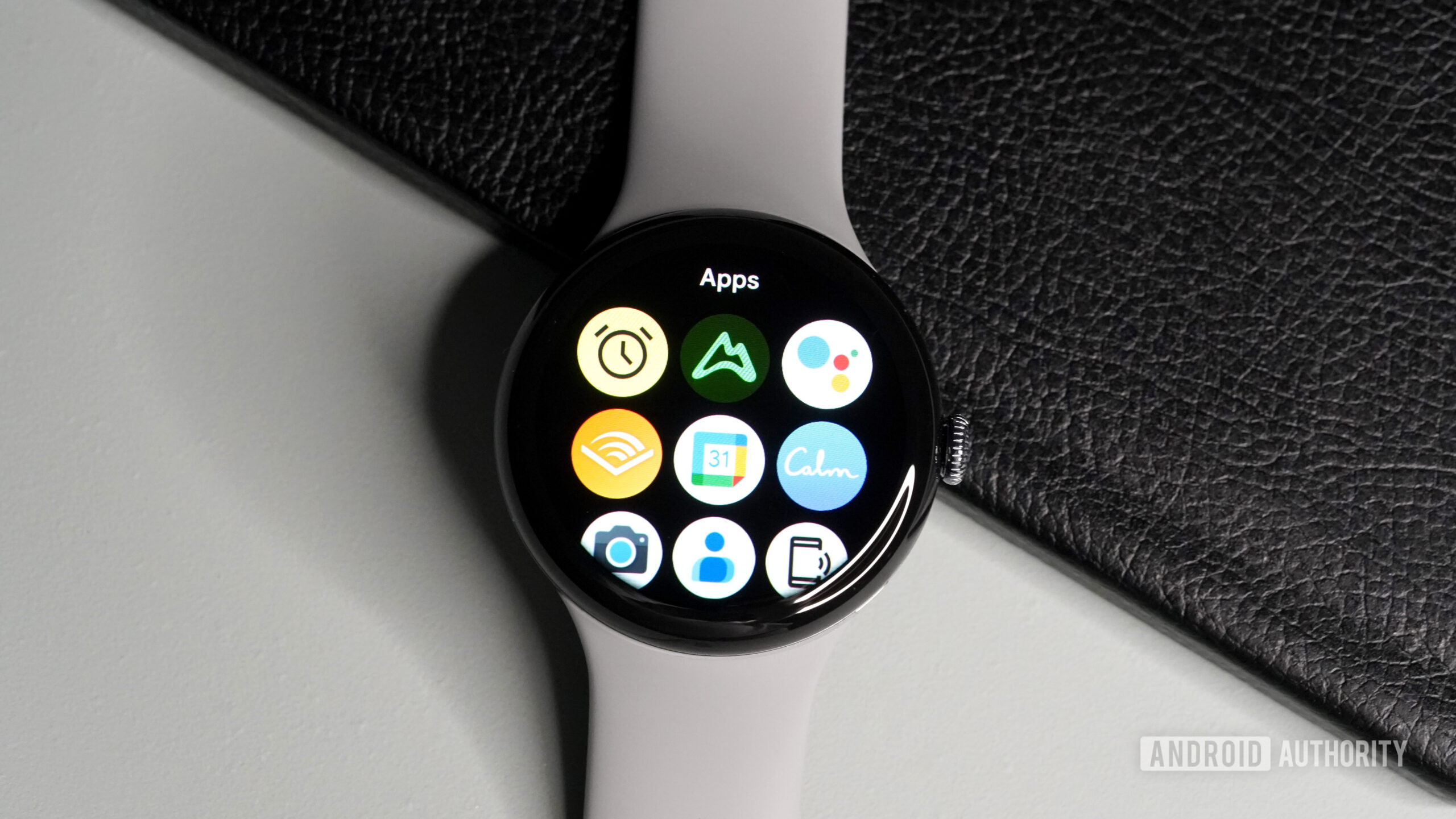 A Google Pixel Watch 3 displays a grid-style apps library.