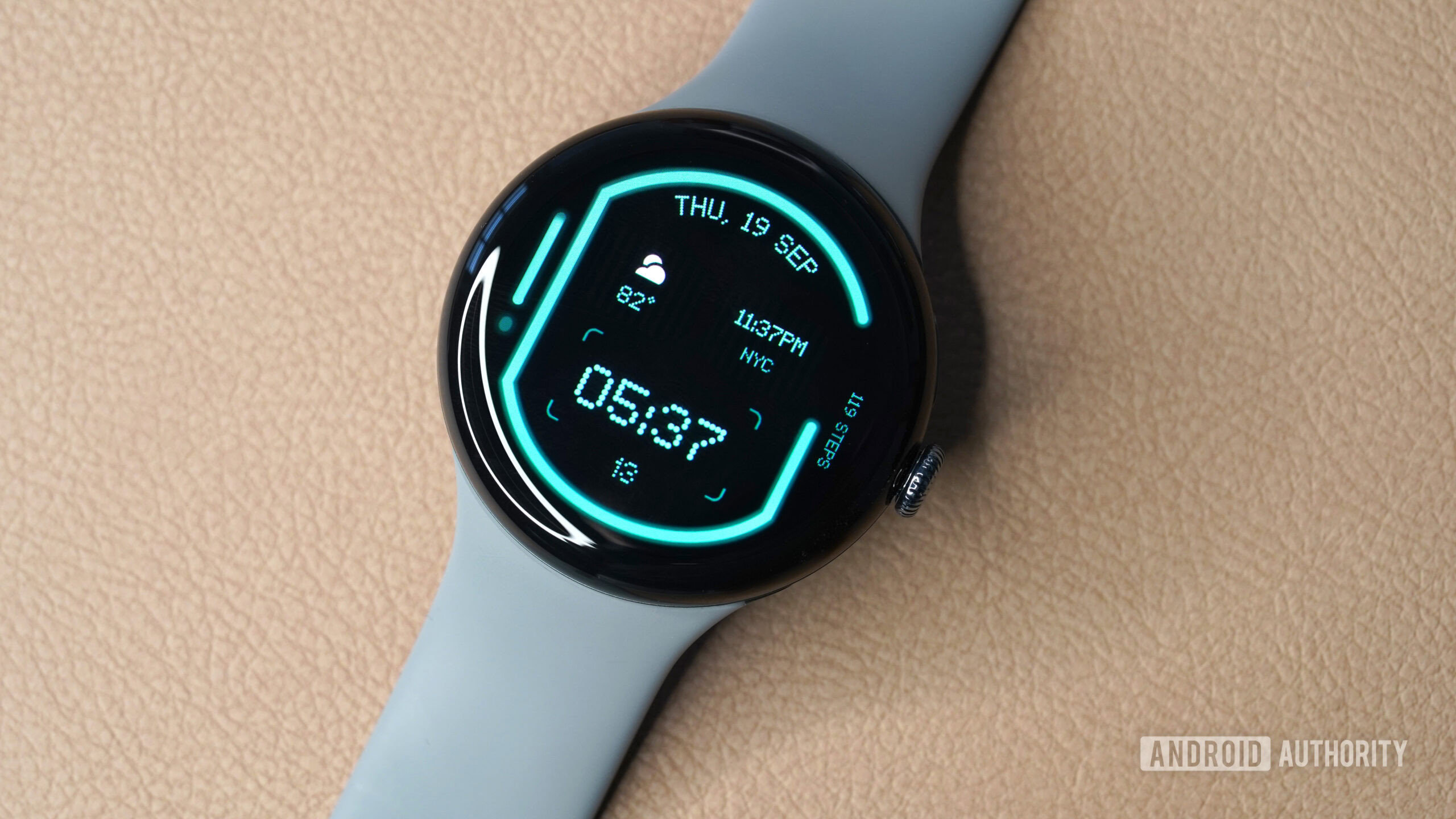 A Google Pixel Watch 3 displays the Glyph watch face.