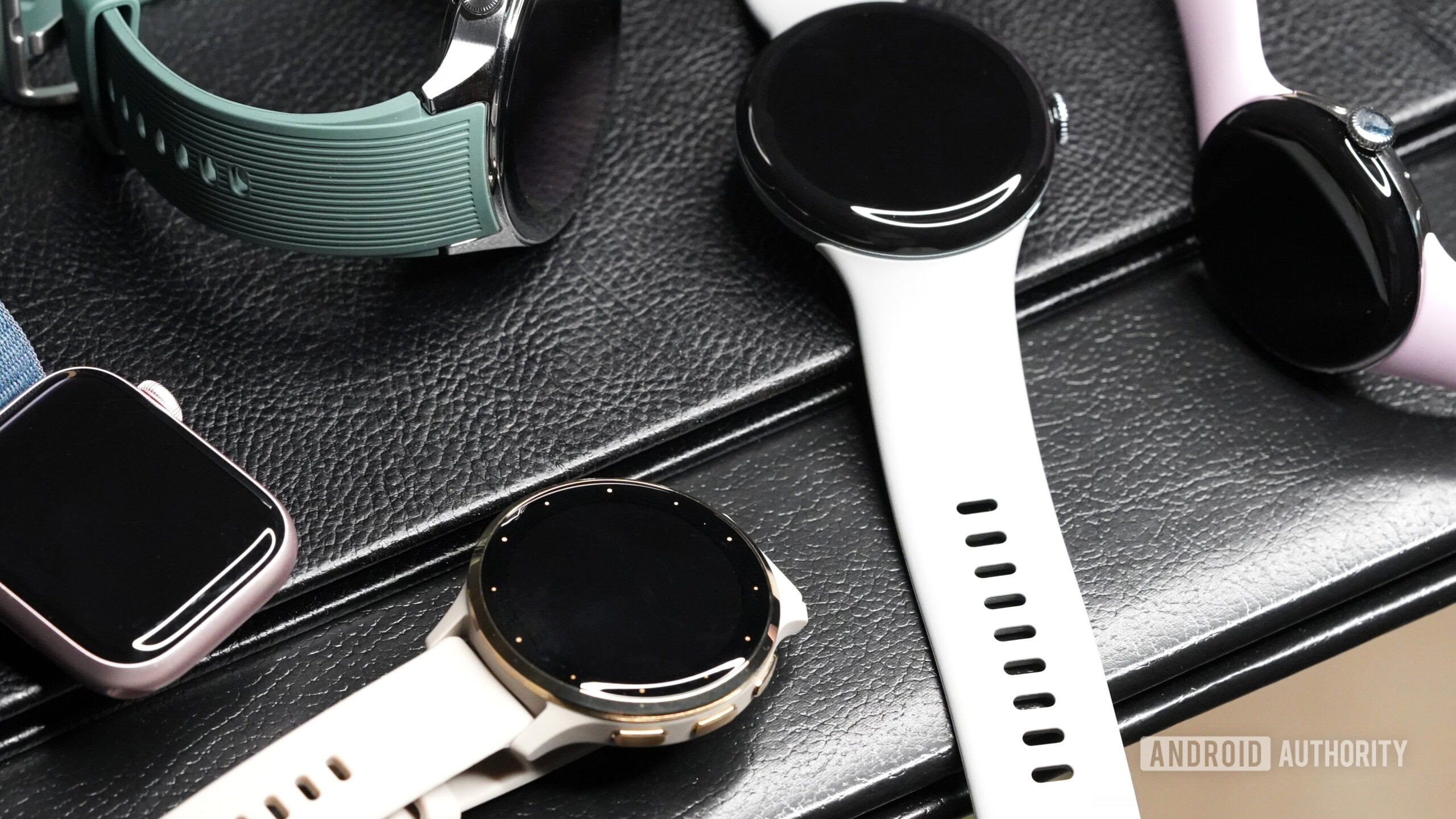 A Google Pixel Watch 3 rests among alternatives from the smartwatch market.