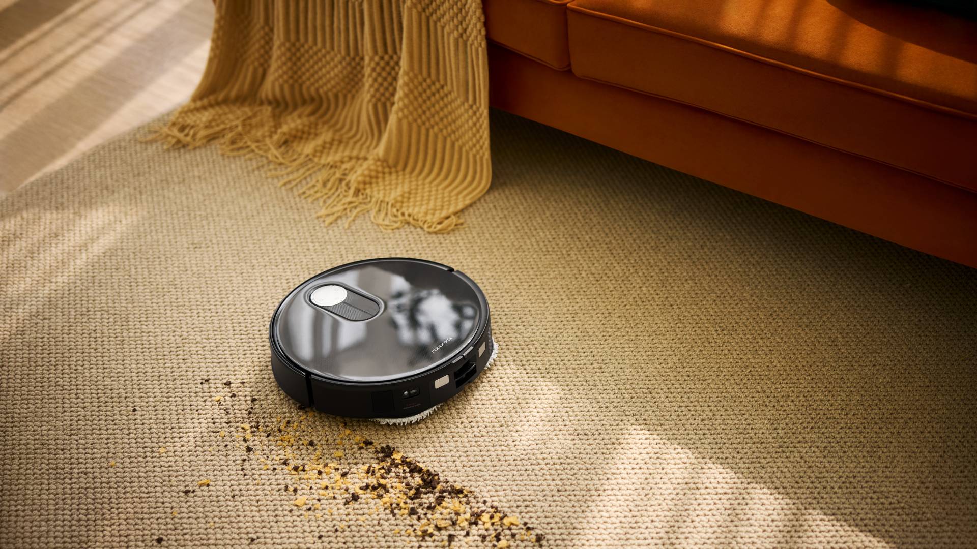 Roborock Qrevo Slim cleaning a carpet.