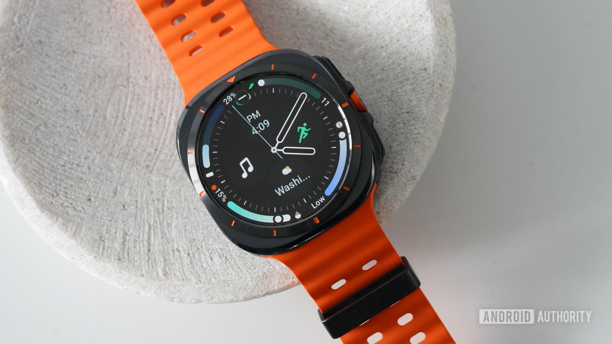 A Samsung Galaxy Watch Ultra displays the Arcs N6 watch face.