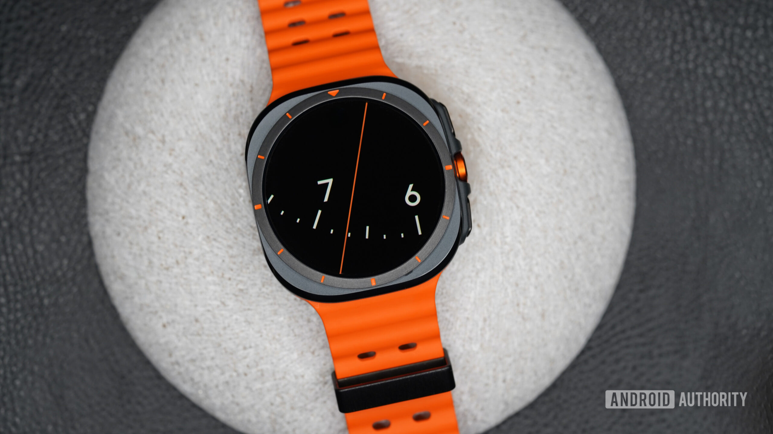 A Samsung Galaxy Watch Ultra displays the watch face Chronos.