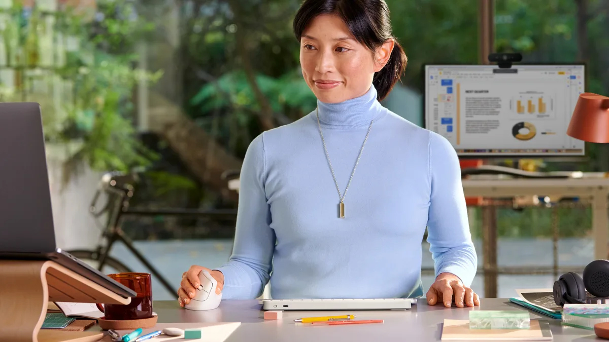 Woman using Logitech Lift mouse