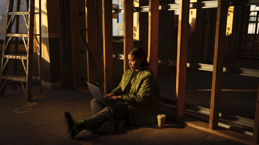 Woman using Apple MacBook Pro M4