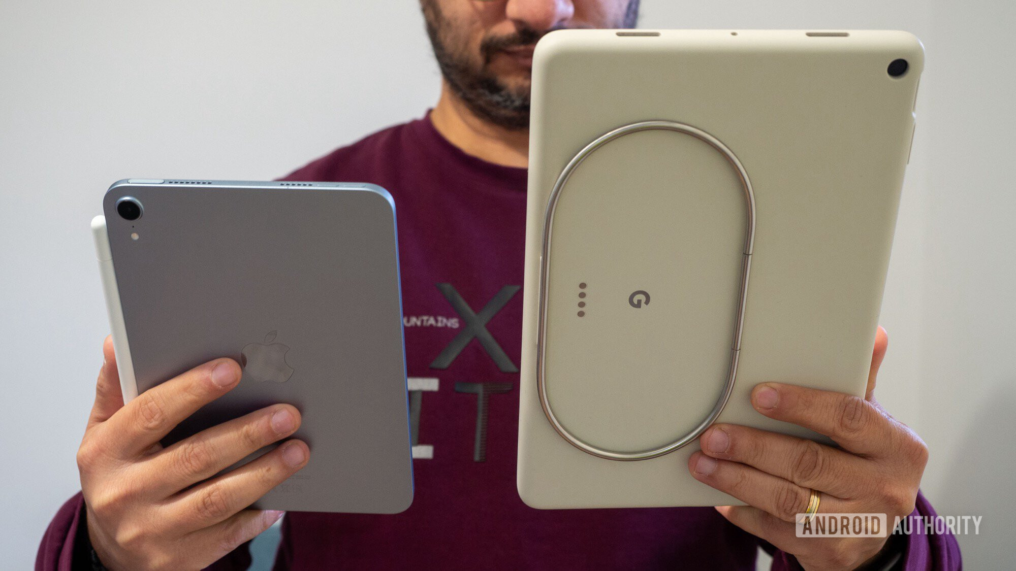 apple ipad mini 7 vs google pixel tablet in hand