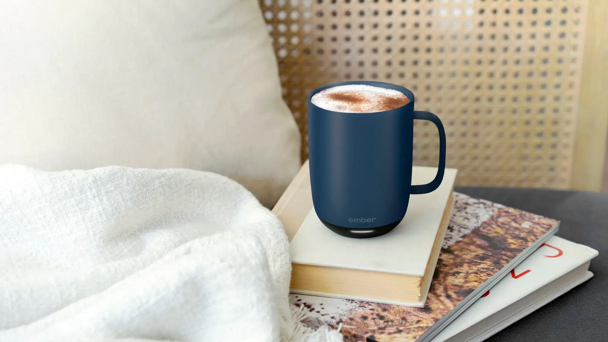 Ember Mug 2 in blue next to bed