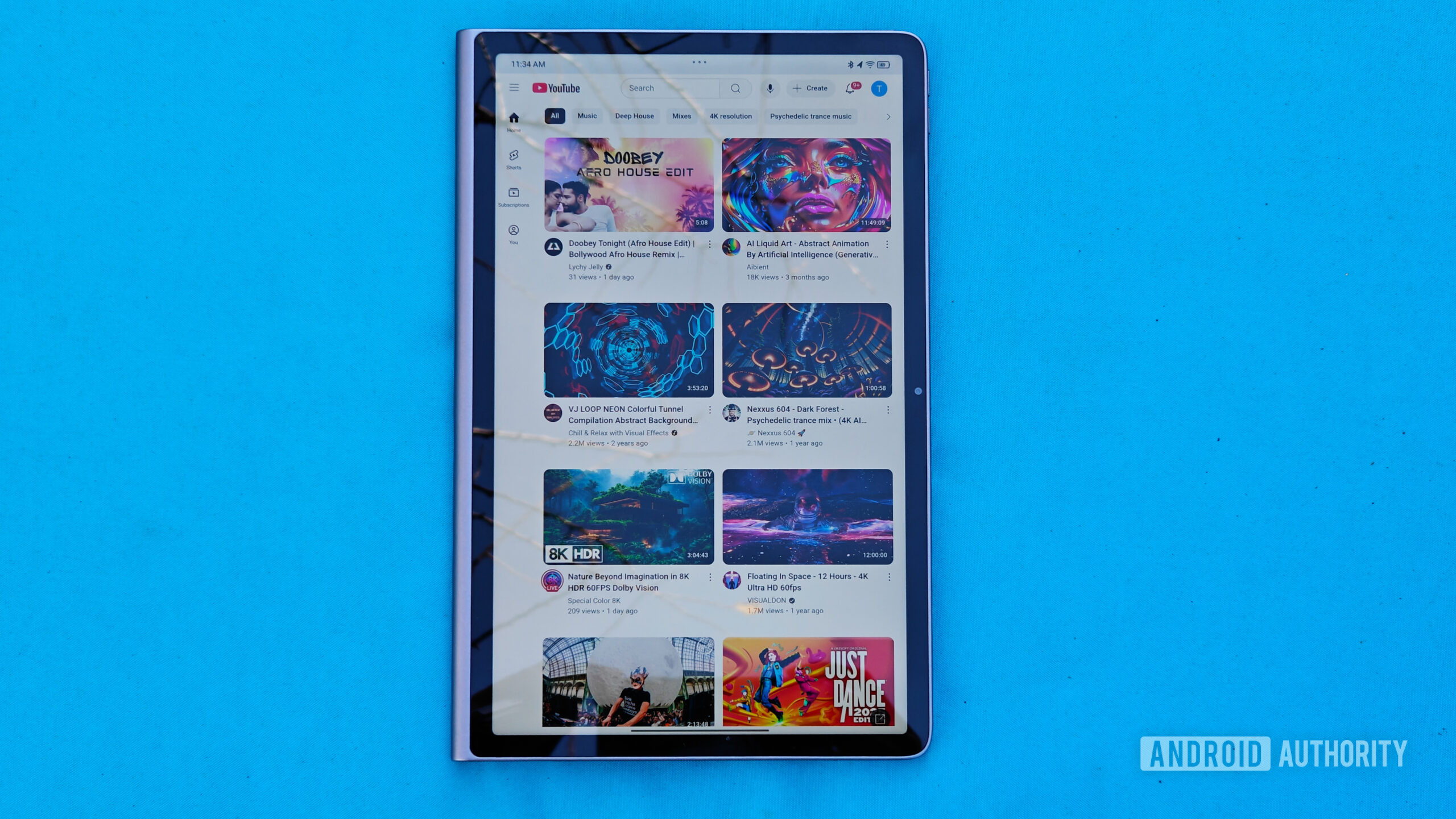 Lenovo Tab Plus review image showing the YouTube homescreen with light reflections