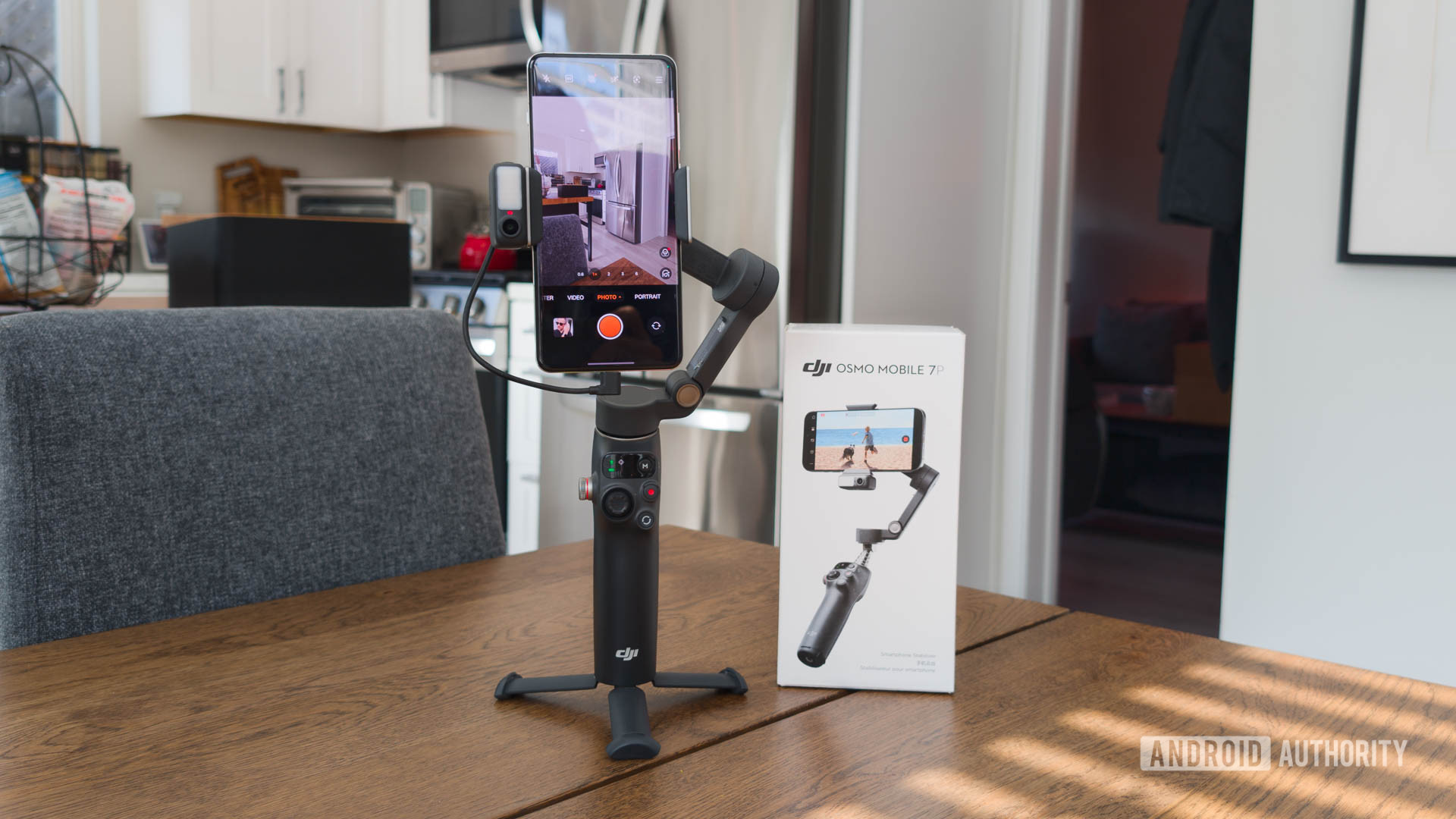 DJI Osmo Mobile 7P on table next to retail box