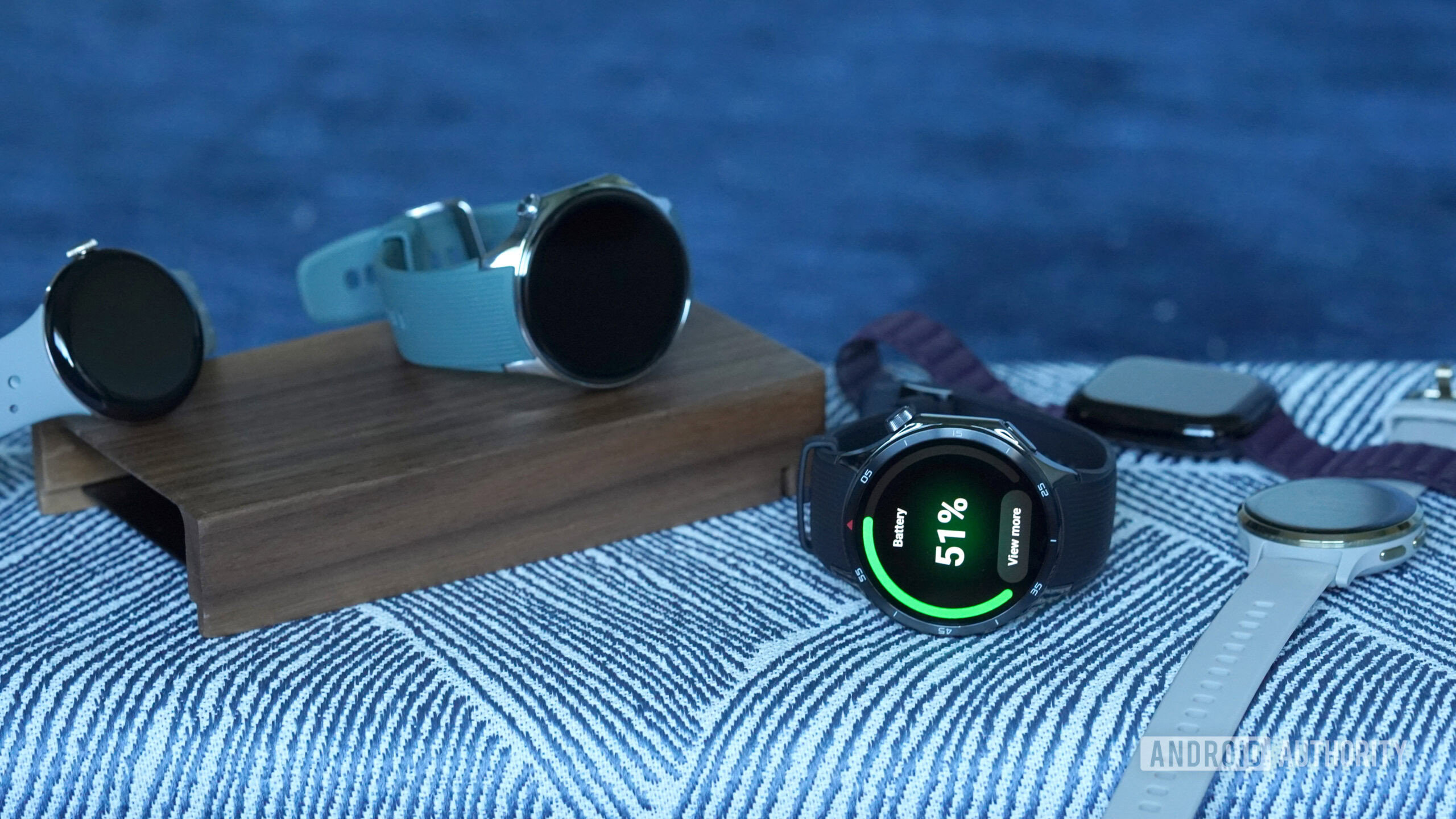 A OnePlus Watch 3 rests alongside alternatives from the market.