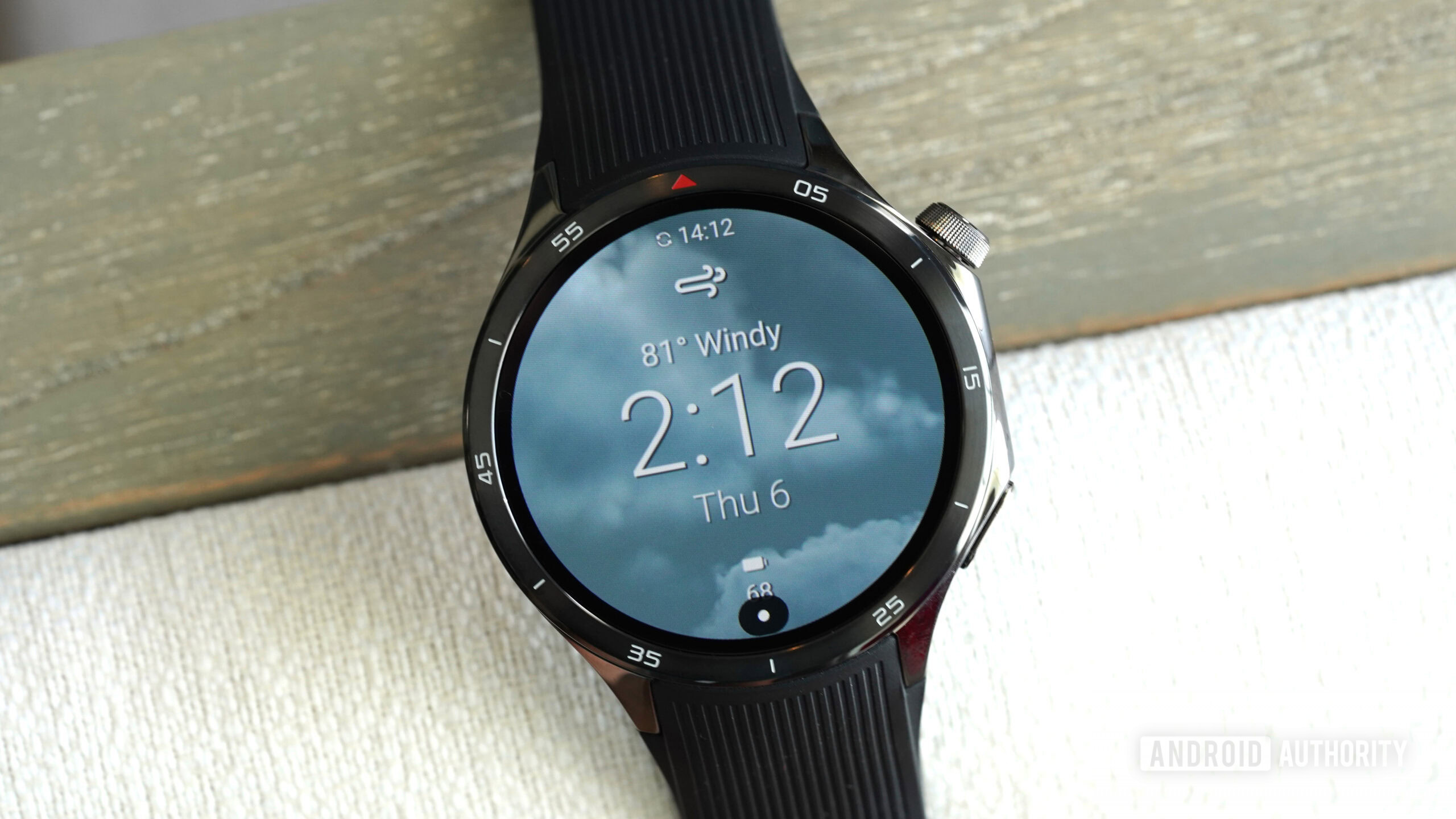 A OnePlus Watch 3 displays the Current Weather WearOS watch face